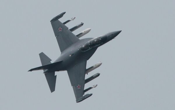 Russian Yak-130 plane performs a flight during a celebration marking the Russian air force's 100th anniversary in Zhukovsky, outside Moscow, Russia, Saturday, Aug. 11, 2012 - Sputnik International
