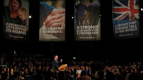 Britain's Prime Minister and leader of the Conservative Party, David Cameron, gestures during his keynote speech at the party's spring forum in Manchester, northern England - Sputnik International