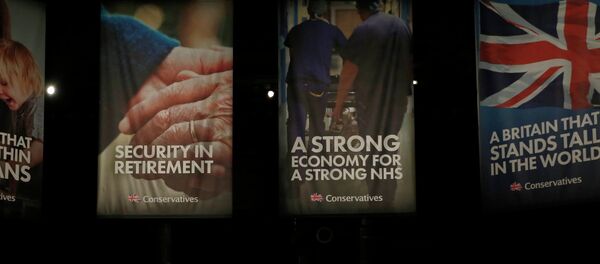 Britain's Prime Minister and leader of the Conservative Party, David Cameron, gestures during his keynote speech at the party's spring forum in Manchester, northern England - Sputnik International
