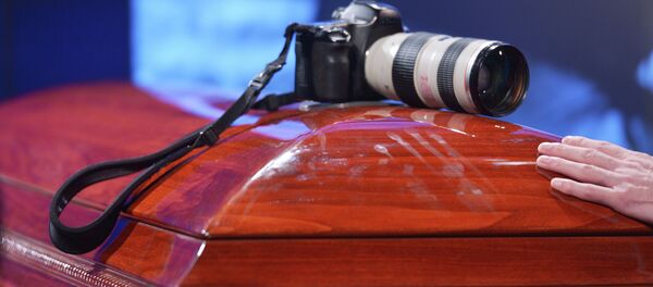 Mourning ceremony for the late photo journalist Andrei Stenin at the Rossiya Segodnya agency's press center. Mourning ceremony for the late photo journalist Andrei Stenin at the Rossiya Segodnya agency's press center. - Sputnik International