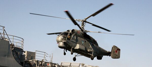 Anti-submarine helicopter Ka-27 hovering over the Guards' missile cruiser Varyag Anti-submarine helicopter Ka-27 hovering over the Guards' missile cruiser Varyag - Sputnik International