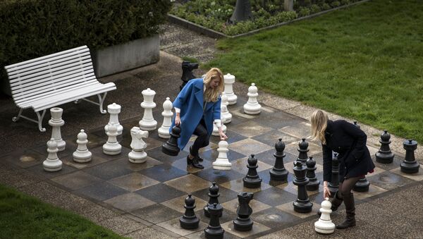 Russian journalists play a game of giant chess in a courtyard of the Beau Rivage Palace Hotel in Lausanne, Switzerland - Sputnik International