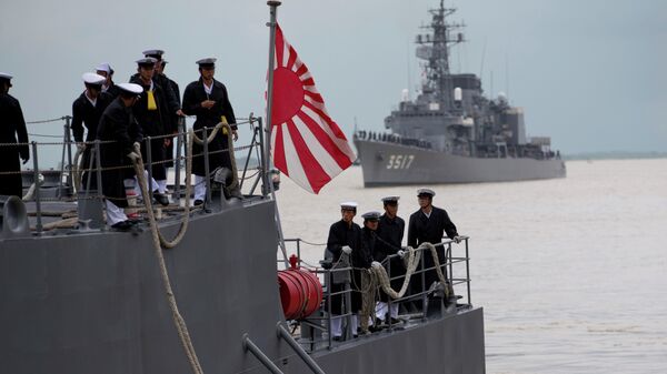 Japanese navy officers stand on the deck of Japan Maritime Self-Defense Force's vessel docked at Thilawa port, Myanmar. - Sputnik International