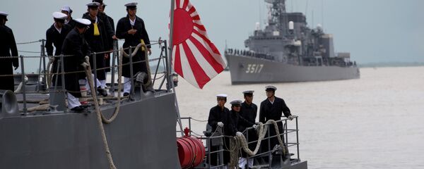 Japanese navy officers stand on the deck of Japan Maritime Self-Defense Force's vessel docked at Thilawa port, Myanmar. Japanese navy officers stand on the deck of Japan Maritime Self-Defense Force's vessel docked at Thilawa port, Myanmar. - Sputnik International