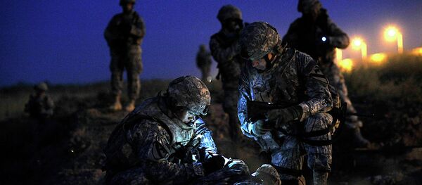 U.S. Army 2nd Lt. Chang Ahn, leader of 2nd Platoon, 5th Battalion, 82nd Field Artillery Regiment, and Maj. David McCulley, battalion operations officer with the 5th Battalion, 82nd Field Artillery Regiment, update perimeter maps to increase base security at Joint Base Balad, Iraq, on Sept. 11, 2008. U.S. Army 2nd Lt. Chang Ahn, leader of 2nd Platoon, 5th Battalion, 82nd Field Artillery Regiment, and Maj. David McCulley, battalion operations officer with the 5th Battalion, 82nd Field Artillery Regiment, update perimeter maps to increase base security at Joint Base Balad, Iraq, on Sept. 11, 2008. - Sputnik International