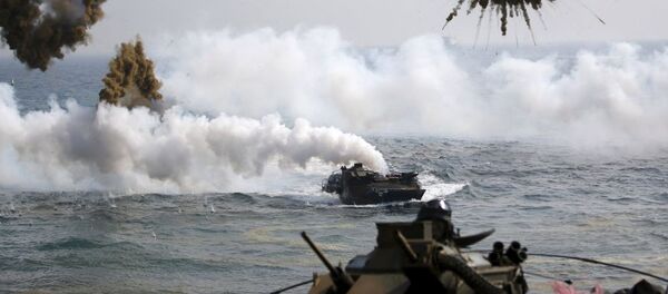 Amphibious assault vehicles of the South Korean Marine Corps throw smoke bombs as they move to land on shore during a U.S.-South Korea joint landing operation drill in Pohang Amphibious assault vehicles of the South Korean Marine Corps throw smoke bombs as they move to land on shore during a U.S.-South Korea joint landing operation drill in Pohang - Sputnik International