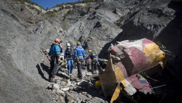 French emergency rescue services work among debris of the Germanwings passenger jet at the crash site near Seyne-les-Alpes, France - Sputnik International