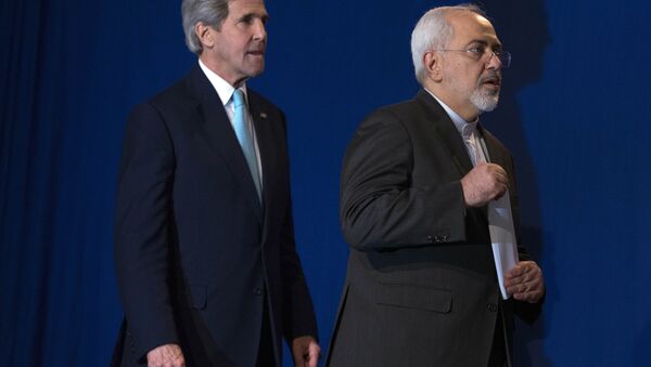 US Secretary of State John Kerry, left, and Iranian Foreign Minister Javad Zarif arrive to deliver a statement, at the Swiss Federal Institute of Technology, or Ecole Polytechnique Federale De Lausanne, in Lausanne, Switzerland, Thursday, April 2, 2015 - Sputnik International