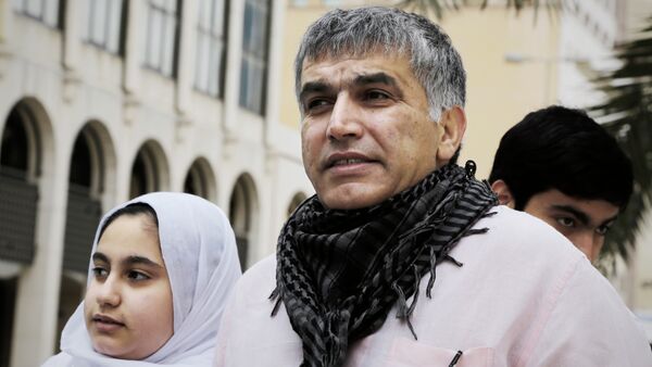Bahraini human rights activist Nabeel Rajab (C) and his daughter Malak (L) leave a court building after attending his appeal hearing on February 11, 2015 in the capital Manama - Sputnik International
