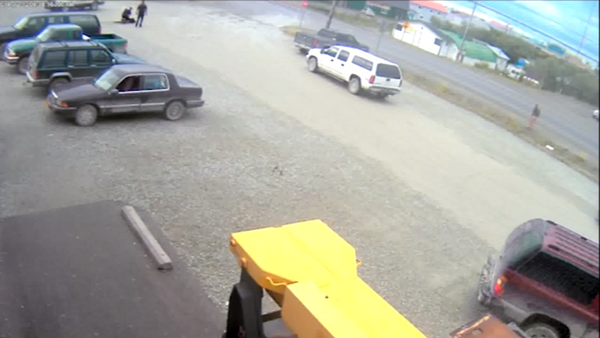 Screen shot from surveillance footage showing a police officer in Alaska repeatedly slamming a man to the ground in a store parking lot during an arrest last summer - Sputnik International