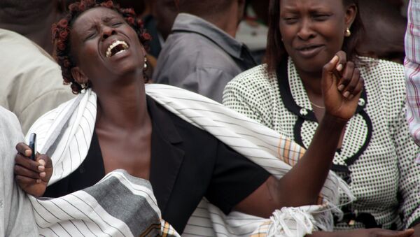 A woman cries after she viewed the body of a relative killed in Thursday's attack on a university, at Chiromo funeral home, Nairobi, Kenya, Saturday, April 4, 201 - Sputnik International