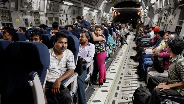 Indians evacuated from Yemen sit inside the Indian Air Force C17 Globemaster aircraft upon their arrival at Chhatrapati Shivaji International Airport in Mumbai, India, Thursday, April 2, 2015 - Sputnik International