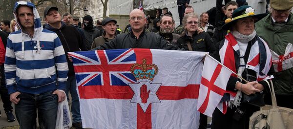 Activists attend a rally by the British off-shoot of the Germany-based PEGIDA movement on Whitehall in central London on April 4, 2015 - Sputnik International