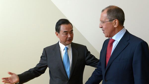 Russian Foreign Minister Sergey Lavrov, right, and Foreign Minister of China Wang Yi meeting during the Ministerial Week of the 68th session of the UN General Assembly - Sputnik International