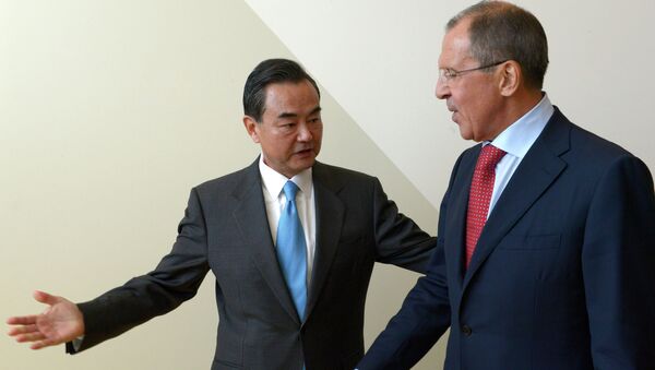 Russian Foreign Minister Sergey Lavrov, right, and Foreign Minister of China Wang Yi meeting during the Ministerial Week of the 68th session of the UN General Assembly - Sputnik International