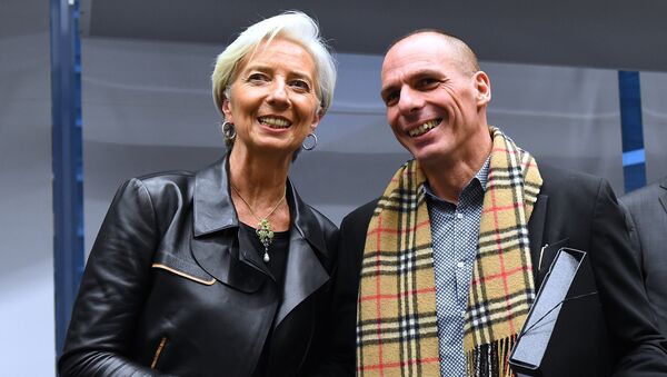 Greek Finance Minister Yanis Varoufakis (R) shakes hands with International Monetary Fund (IMF) Director Christine Lagarde during an emergency Eurogroup finance ministers meeting at the European Council in Brussels on February 11, 2015 - Sputnik International