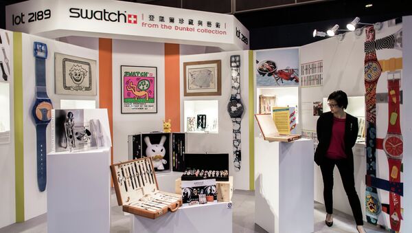 A woman looks at Swatch watches from the Dunkel collection displayed by auction house Sotheby's in Hong Kong on April 2, 2015 - Sputnik International
