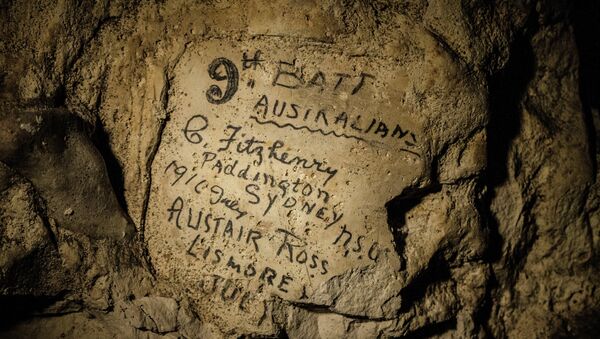 In this image made on Feb. 20, 2015 showing names engraved on the walls of a former chalk quarry, at the Cite Souterraine, Underground City, in Naours, northern France by 9th Batt Australians, G. Fitzhenry of Paddington, Sydney from 1916 July and Alistair Ross, Lismore, Australia - Sputnik International