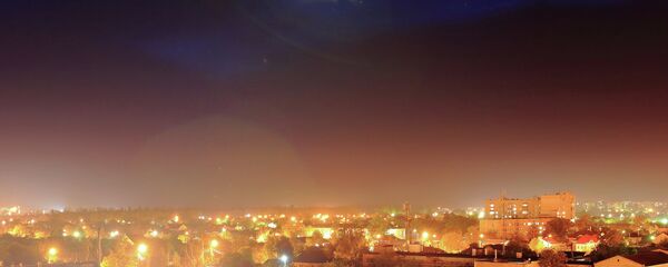 A UFO over a town A UFO over a town - Sputnik International