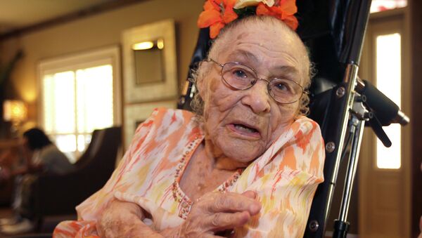 In this Thursday, July 3, 2014 photo, Gertrude Weaver poses at Silver Oaks Health and Rehabilitation Center in Camden, Ark., a day before her 116th birthday - Sputnik International