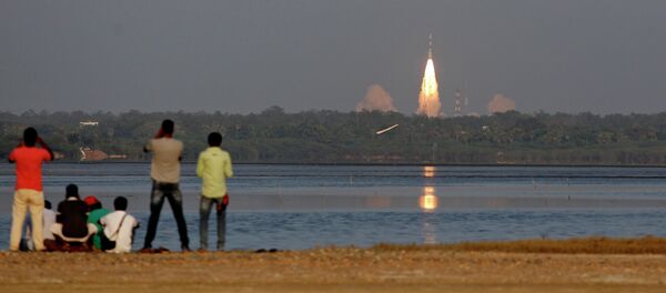 People watch the PSLV-C27 take off carrying India's fourth navigational satellite, in Sriharikota, India, Saturday, March 28, 2015 People watch the PSLV-C27 take off carrying India's fourth navigational satellite, in Sriharikota, India, Saturday, March 28, 2015 - Sputnik International