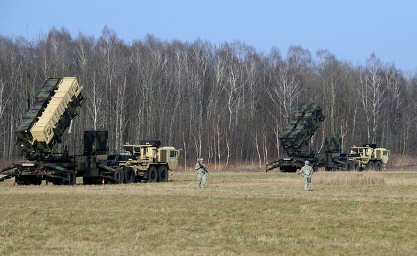 This picture taken on March 21, 2015 shows US troops from the 5th Battalion of the 7th Air Defense Regiment emplace a launching station of the Patriot air and missile defence system at a test range in Sochaczew, Poland This picture taken on March 21, 2015 shows US troops from the 5th Battalion of the 7th Air Defense Regiment emplace a launching station of the Patriot air and missile defence system at a test range in Sochaczew, Poland - Sputnik International