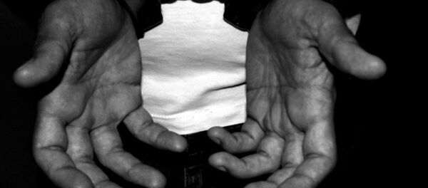 A handcuffed man - Sputnik International