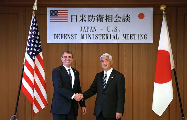 U.S. Defense Secretary Ash Carter, left, and Japan's Defense Minister Gen Nakatani shake hands prior to a meeting at the Defense Ministry in Tokyo. U.S. Defense Secretary Ash Carter, left, and Japan's Defense Minister Gen Nakatani shake hands prior to a meeting at the Defense Ministry in Tokyo. - Sputnik International