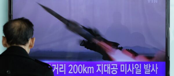 A South Korean man watches a TV news program showing the file footage of the missile launch conducted by North Korea. A South Korean man watches a TV news program showing the file footage of the missile launch conducted by North Korea. - Sputnik International