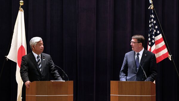 U.S. Defense Secretary Ash Carter, right, and Japan's Defense Minister Gen Nakatani speak during a press conference at the Defense Ministry in Tokyo - Sputnik International
