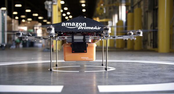This undated image provided by Amazon.com shows the so-called Prime Air unmanned aircraft project that Amazon is working on in its research and development labs. This undated image provided by Amazon.com shows the so-called Prime Air unmanned aircraft project that Amazon is working on in its research and development labs. - Sputnik International