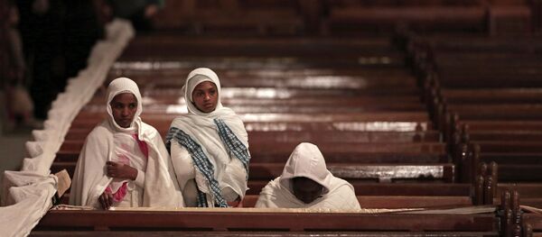 Ethiopian Christian women pray during the Easter Eve service at St. Mark's Cathedral, in Cairo, Egypt - Sputnik International