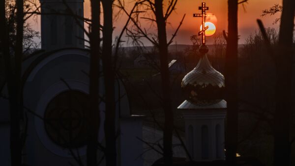 The Sun sets behind the St. Yelisei’s Lavrishevo monetary during Orthodox Easter at the village of Gnesichi in the Grodno region, about 150 km from Minsk - Sputnik International