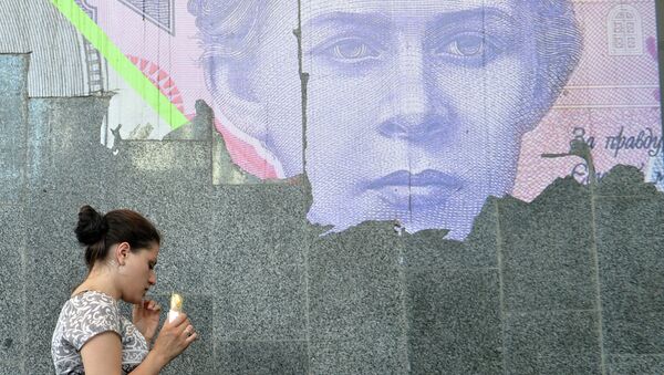 A woman eats ice-cream next to a torned poster depicting Ukrainian 200-hrivnya banknote at the metro entrance in Kiev - Sputnik International