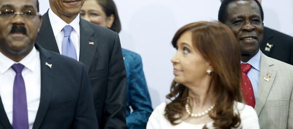 U.S. President Barack Obama (2nd L) shares a look with Argentina's President Cristina Fernandez de Kirchner (front R) during a group photo at the first plenary session of the Summit of the Americas in Panama City, Panama U.S. President Barack Obama (2nd L) shares a look with Argentina's President Cristina Fernandez de Kirchner (front R) during a group photo at the first plenary session of the Summit of the Americas in Panama City, Panama - Sputnik International