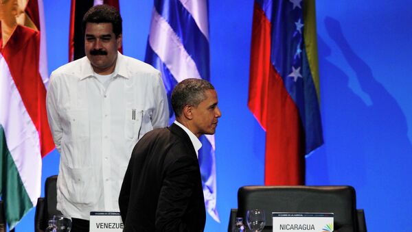 President Barack Obama walks past the empty seat of Nicaragua as he leaves the opening ceremony of the sixth Summit of the Americas after shaking hands with Venezuela's Prime Minister Nicolas Maduro, left, in Cartagena, Colombia, Saturday April 14, 2012 - Sputnik International