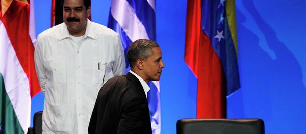 President Barack Obama walks past the empty seat of Nicaragua as he leaves the opening ceremony of the sixth Summit of the Americas after shaking hands with Venezuela's Prime Minister Nicolas Maduro, left, in Cartagena, Colombia, Saturday April 14, 2012 President Barack Obama walks past the empty seat of Nicaragua as he leaves the opening ceremony of the sixth Summit of the Americas after shaking hands with Venezuela's Prime Minister Nicolas Maduro, left, in Cartagena, Colombia, Saturday April 14, 2012 - Sputnik International