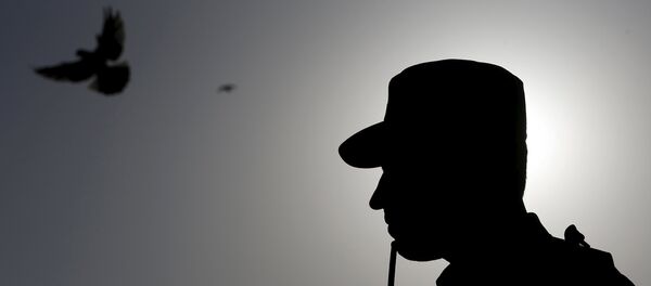 An Afghan policeman stands guard An Afghan policeman stands guard - Sputnik International