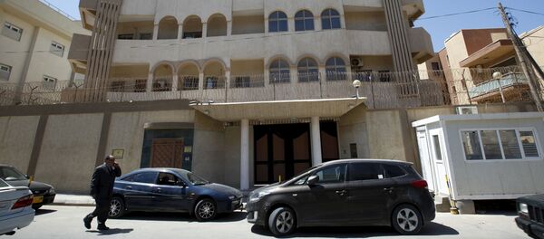 A man walks past the South Korean embassy after it was attacked by gunmen in Tripoli April 12, 2015. A man walks past the South Korean embassy after it was attacked by gunmen in Tripoli April 12, 2015. - Sputnik International