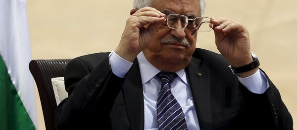 Palestinian President Mahmoud Abbas adjusts his glasses as he attends the opening ceremony of a park in the West Bank city of Ramallah April 5, 2015 Palestinian President Mahmoud Abbas adjusts his glasses as he attends the opening ceremony of a park in the West Bank city of Ramallah April 5, 2015 - Sputnik International