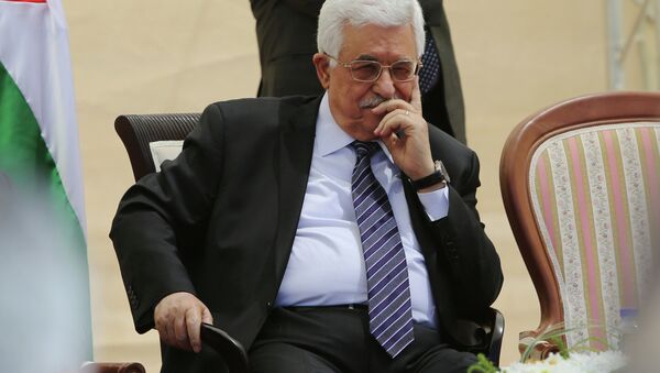 Palestinian president Mahmud Abbas looks on during an opening ceremony of the Istiqlal (independence) garden in the West Bank city of Ramallah on April 5, 2015 - Sputnik International