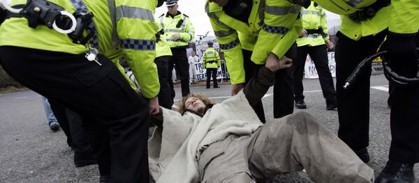Campaigners stage a protest in front of the Trident submarine fleet naval base in Faslane, Scotland Campaigners stage a protest in front of the Trident submarine fleet naval base in Faslane, Scotland - Sputnik International
