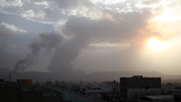 Smoke billows at a military site after it was hit by an air strike at the Faj Attan mountain of Sanaa - Sputnik International