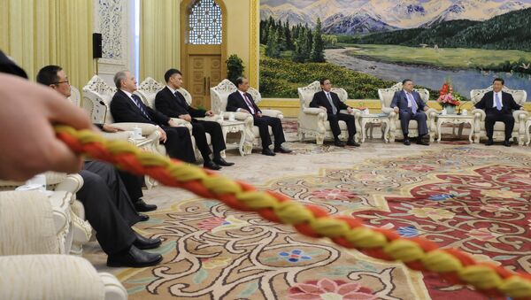 China's Vice President Xi Jinping (far R) holds talks with delegates of The Seventh Meeting of the SCO Security Council Secretaries at the Great Hall of the People in Beijing on April 12, 2012 - Sputnik International