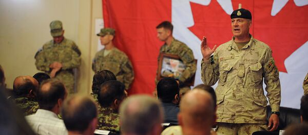 Brigadier General Dean Milner, Commander of Canadian forces in Afghanistan, speaks with soldiers after a handover ceremony to US forces at Kandahar airbase Brigadier General Dean Milner, Commander of Canadian forces in Afghanistan, speaks with soldiers after a handover ceremony to US forces at Kandahar airbase - Sputnik International