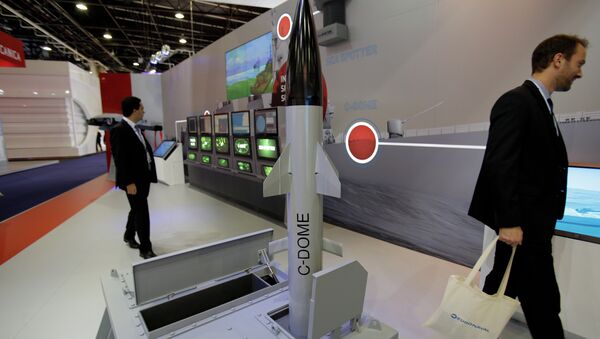 Visitors walk past a model of Israeli weapon company Rafael' C-Dome is presented at the Euronaval show, in Le Bourget, north of Paris. - Sputnik International