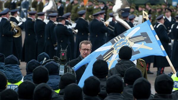 Estonian President Toomas Hendrik Ilves reviews the troop ahead of a military parade to celebrate 97 years since first achieving independence in 1918 - Sputnik International