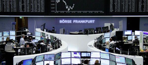 Traders are pictured at their desks in front of the DAX board at the Frankfurt stock exchange April 14, 2015 Traders are pictured at their desks in front of the DAX board at the Frankfurt stock exchange April 14, 2015 - Sputnik International