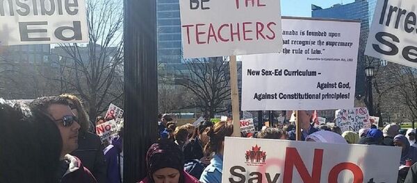 So far more than 500 people have gathered at Queen's Park in Toronto to protest Kathleen Wynne's sex-ed curriculum So far more than 500 people have gathered at Queen's Park in Toronto to protest Kathleen Wynne's sex-ed curriculum - Sputnik International
