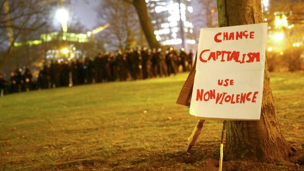 A protest placard is propped against a tree during an anti-capitalist demonstration in Frankfurt March 18, 2015 - Sputnik International